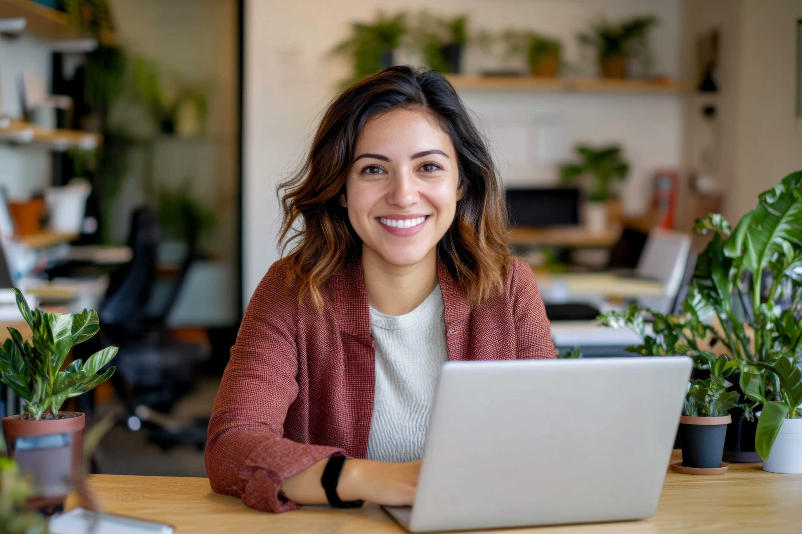 Happy young woman using laptop at desk, remote working from home, online studying, or attending virtual meeting, smiling professional learning in modern home office Image
